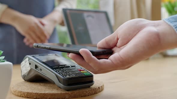 Mobile phone contactless paying cashless e-wallet digital payment.