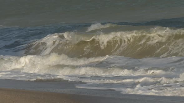 Wave of the Sea on the Sand Beach