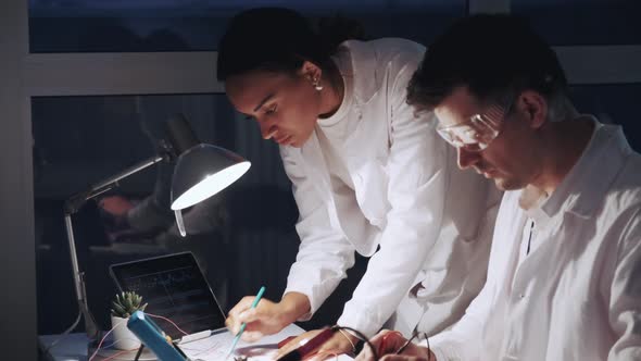 Close Up of African American Woman and Man in Protective Glasses Working in Modern Electronics