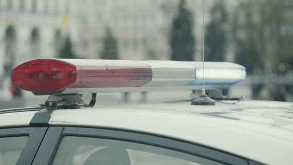 Flashing Flasher on the Roof of a Police Car. Blinker. Close-up.