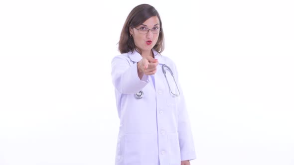 Happy Beautiful Woman Doctor Pointing at Camera