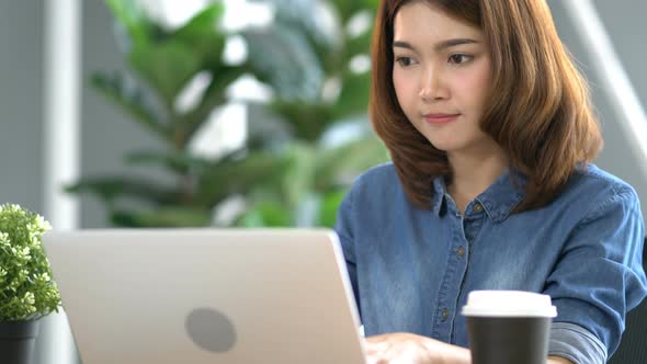 beautiful asian smart woman work with energy and happiness joyful in modern office background