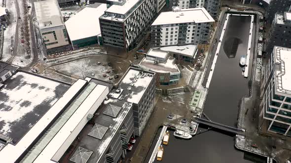 Aerial footage of a snowy winters day in the city of Leeds in the UK