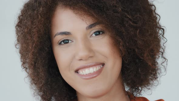 Close Up Portrait Headshot Female Face Smiling 30s Millennial African American Woman Looking at