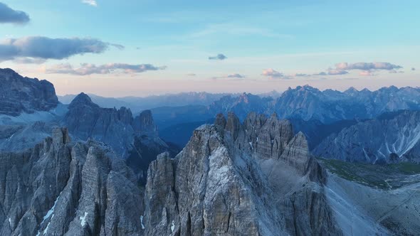 Rotating reveal drone shoot of the famous three peaks (3 Zinnen - Tre Cime) in the Dolomites.