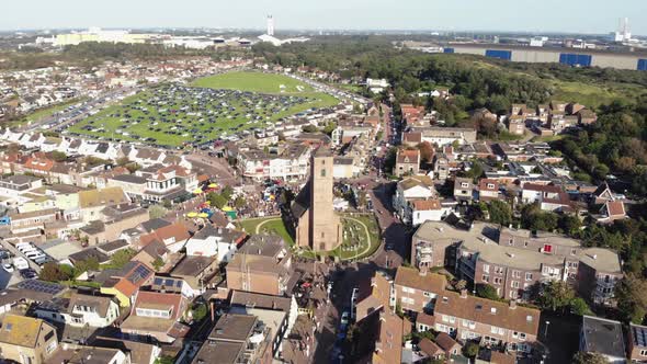 Aerial 4k footage, panning the horizon of the small coastal town of Wijk aan Zee in North Holland