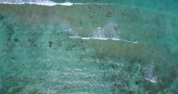 Tropical drone clean view of a paradise sunny white sand beach and blue water background in vibrant 