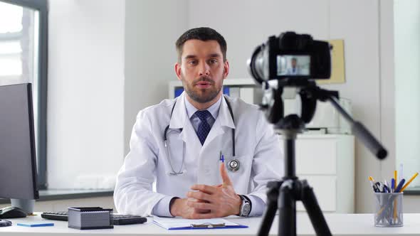 Doctor with Camera Recording Video Blog at Clinic