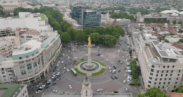 Drone shot of a traffic around Saint George monument on the Liberty Square.