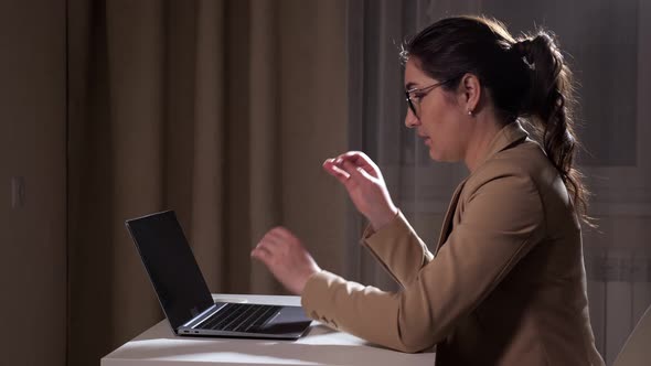 Sleepy Brunette Types on Laptop and Takes Off Glasses