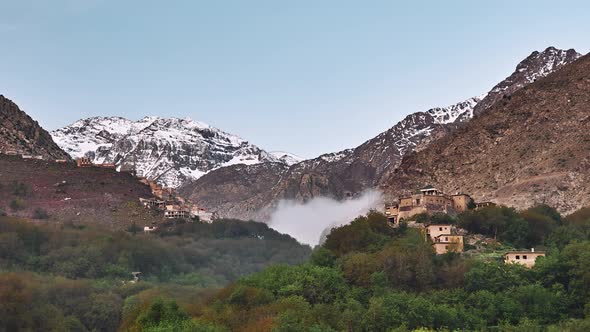 Morning fog under Jebel Toubkal in Imlil valley, Morocco, Time Lapse