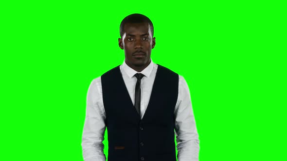 Businessman Wearing a Suit Hold a Cardboard Sign That Asks About Desire To Find a Job. Green Screen