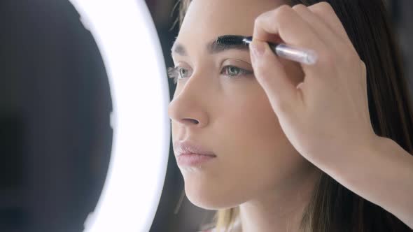 Caucasian Fashion Model Gets Her Eyebrows Modeling