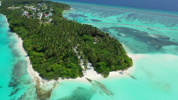 Natural flying clean view of a white sand paradise beach and aqua turquoise water background 