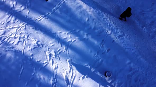 Aerial view of a drone flying over the winter park.