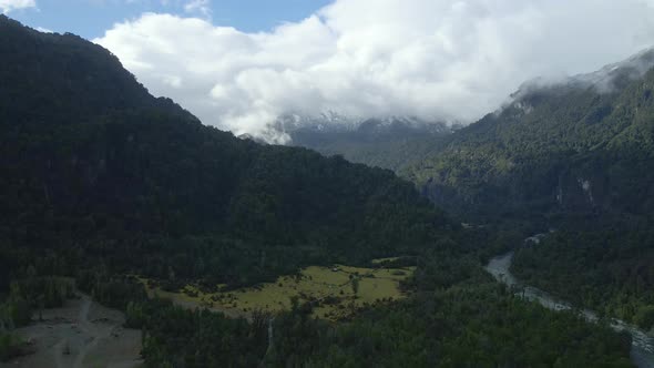 Aerial view truck right of Rio Blanco and the mountains of Hornopiren National Park, Hualaihue, Chil