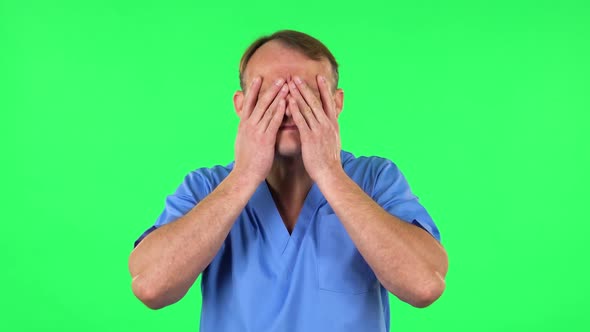 Medical Man Suffering From Headache From Fatigue. Green Screen