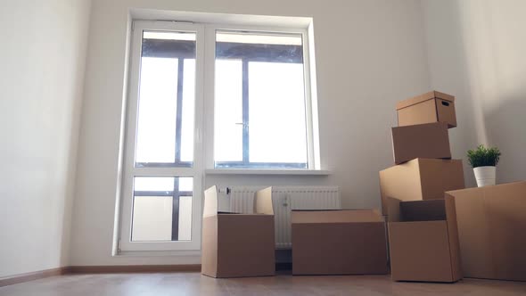 Stack of Cardboard Boxes for Moving in Interior Apartment, Movement or Real Estate Concept