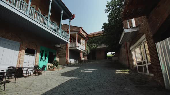 Signagi, Georgia. Buildings Old Architecture Brick Stonework Paved Road, Vineyards on Balconies