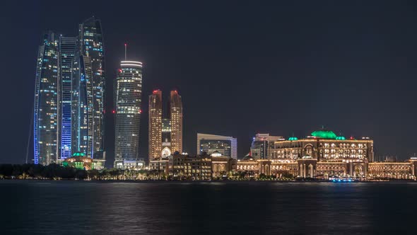 Skyscrapers of Abu Dhabi at Night with Etihad Towers Buildings Timelapse