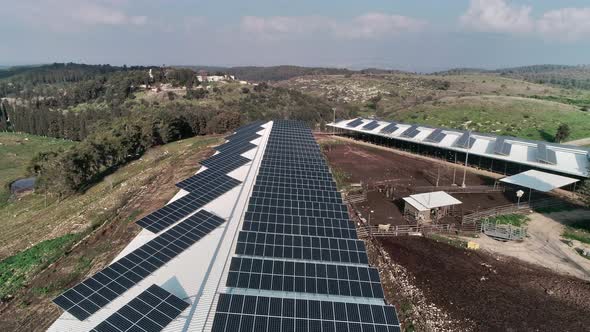 Aerial footage over chicken farm covered with solar panels in northern Israel