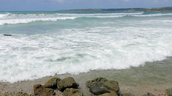 Sea Waves break over stone 