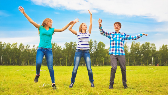 Teens Dancing in a Meadow