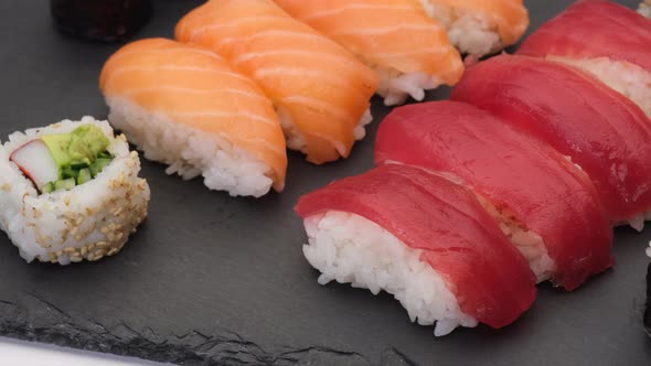 Sushi assortment with salmon nigiri, tuna nigiri, hosomaki and uramaki. Raw fish and rice Japanese A