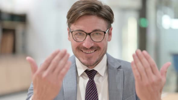 Portrait of Inviting Businessman