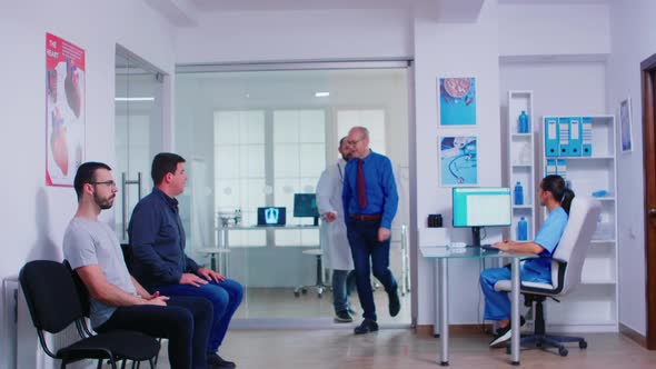 Young Doctor Talking with Disabled Woman