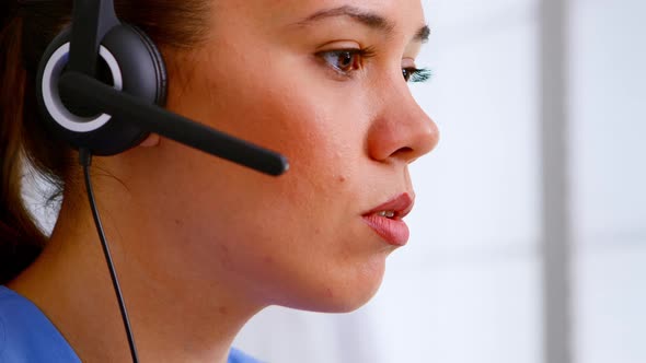 Close Up of Medical Operator with Headphone Consulting Patients