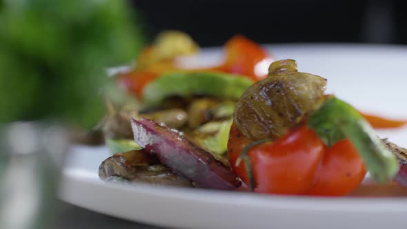 Putting Grilled Vegetables on Dish