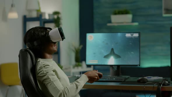 Black Woman Gamer Playing Video Game at Powerful Computer Using VR