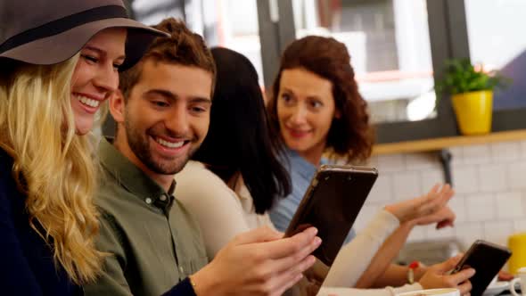 Executives using digital tablet at table 4k