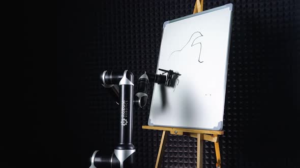 Robor Draws a Woman Face, a Futuristic Robot Arm Draws a Marker on a Blackboard, Modern Technology