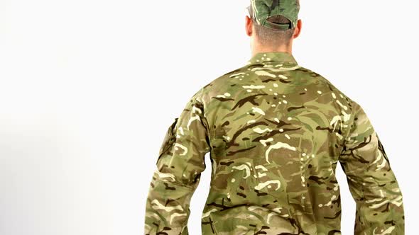 Soldier saluting on white background