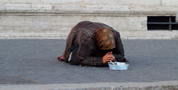 Poor Woman Begging in the Streets of Rome