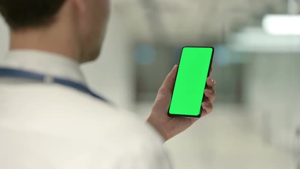 Male Doctor Using Smartphone with Chroma Screen