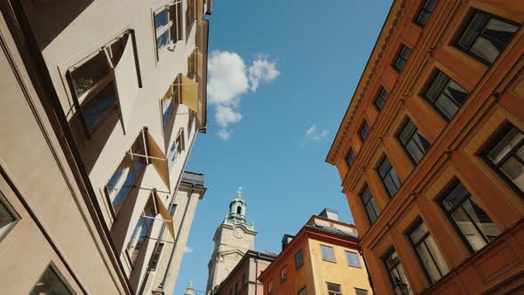 Low Angle Wide Shot To St Nicholas - Storkyrkan Bell Tower in Stockholm. View Through a Narrow