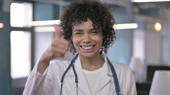 Portrait of Successful Young Professional Doctor Looking and Doing Thumbs Up