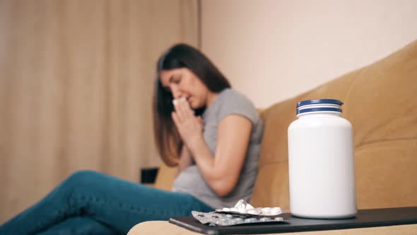 Blurred Lady with Long Hair Sneezes and Coughs at Home