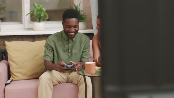 Young Biracial Couple Playing Video Games