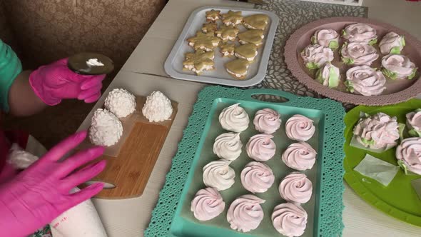 A Woman Prepares Marshmallow Cones. Ready Made Sweets Are Laid Out On Trays. Close Up Shot.