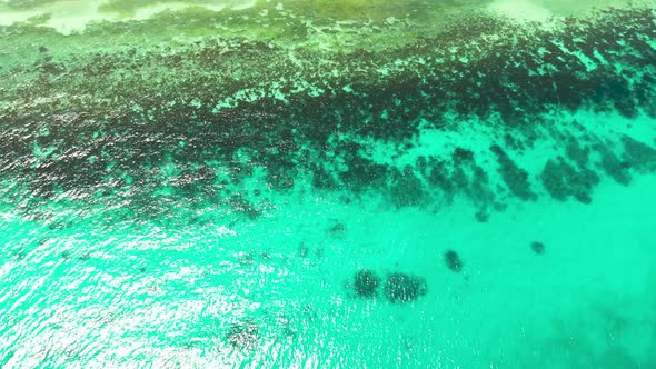 Sea Surface in a Turquoise Lagoon Top View