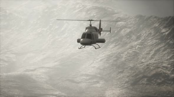 Extreme Slow Motion Flying Helicopter Near Mountains with Fog alt