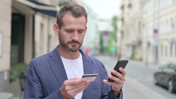 Mature Adult Man Having Online Payment Failure on Smartphone