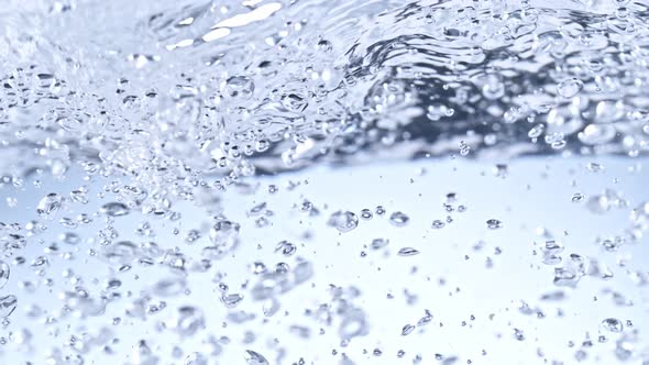 Super Slow Motion Shot of Clear Water Wave And Bubbles Isolated on White Background at 1000Fps