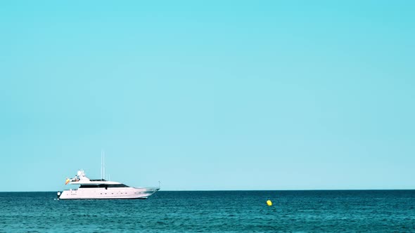 Yacht visible from the Mediterranean sea coast in Barcelona, Spain