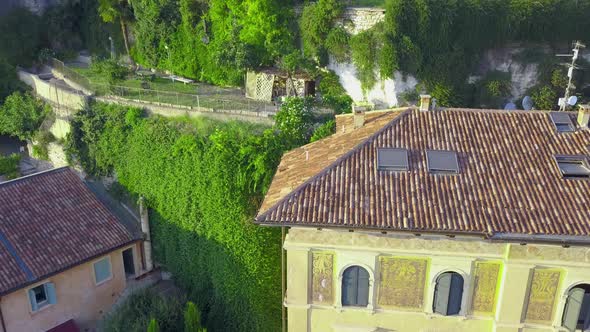 Panorama of Verona historical city centre, bridges across Adige river.Buildings with red tiled roofs