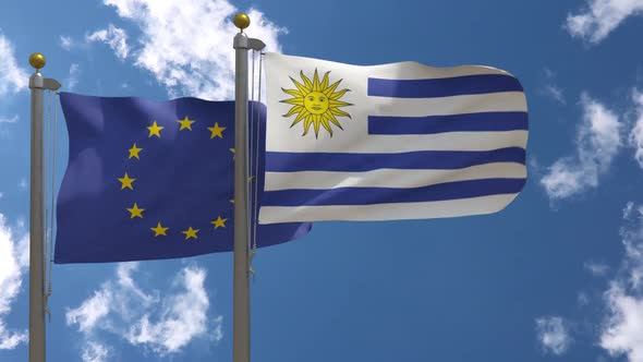 European Union Flag Vs Uruguay Flag On Flagpole